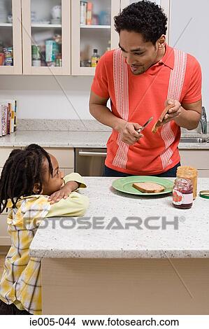 Father and son in the kitchen View Large Photo Image Picture - Father and son in the kitchen. Fotosearch