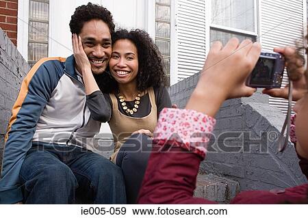 Girl photographing father and mother View Large Photo Image Stock Photo - Girl photographing father and mother. Fotosearch