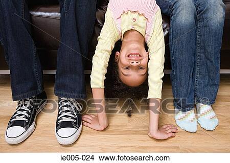 Picture - Girl upside down. Fotosearch