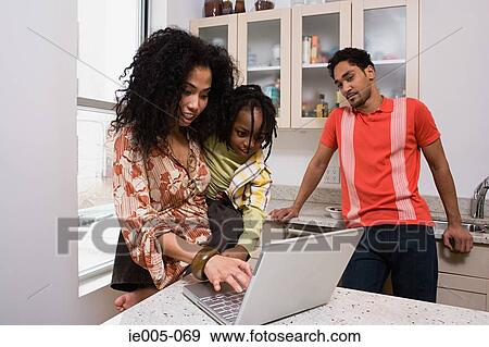 Mother and son using laptop View Large Photo Image Stock Photo - Mother and son using laptop. Fotosearch