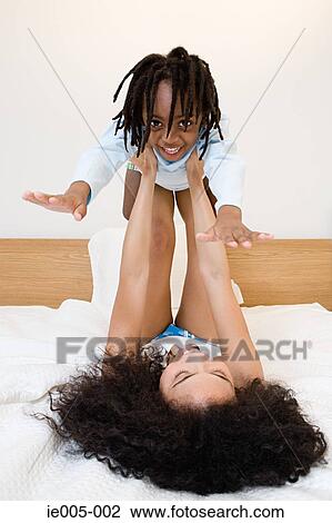Mother playing with son View Large Photo Image Stock Image - Mother playing with son. Fotosearch