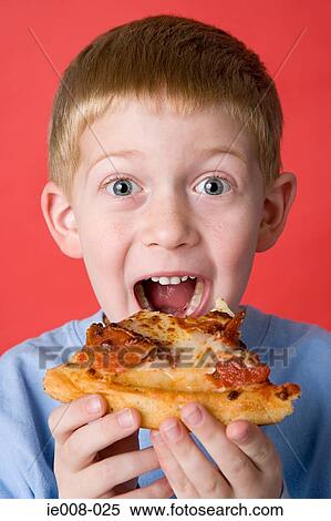 Boy eating pizza View Large Photo Image Stock Photography - Boy eating pizza. Fotosearch