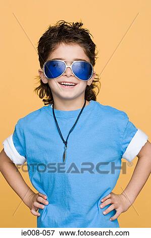 Stock Photo - Boy wearing large sunglasses. Fotosearch