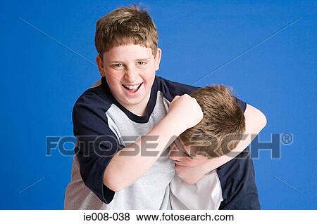 Stock Photo - Boys playfighting. Fotosearch