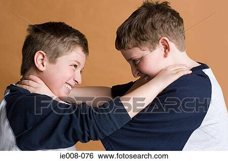 Stock Photograph - Boys strangling eachother. Fotosearch
