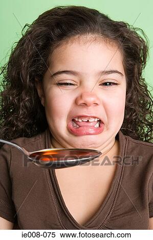 Girl disgusted at medicine View Large Photo Image Stock Photography - Girl disgusted at medicine. Fotosearch