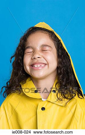 Girl in a raincoat View Large Photo Image Picture - Girl in a raincoat. Fotosearch