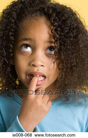 Stock Photo - Girl looking confused. Fotosearch