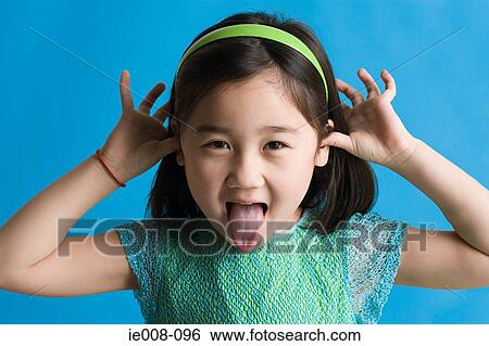 Girl making faces View Large Photo Image Stock Photograph - Girl making faces. Fotosearch
