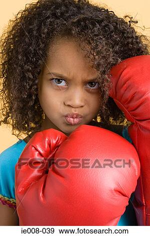 Girl wearing boxing gloves View Large Photo Image Stock Photo - Girl wearing boxing gloves. Fotosearch