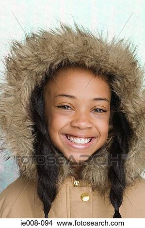 Girl wearing coat with furry hood View Large Photo Image Picture - Girl wearing coat with furry hood. Fotosearch