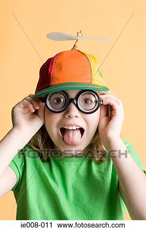 Girl wearing silly glasses and hat View Large Photo Image Stock Image - Girl wearing silly glasses and hat. Fotosearch