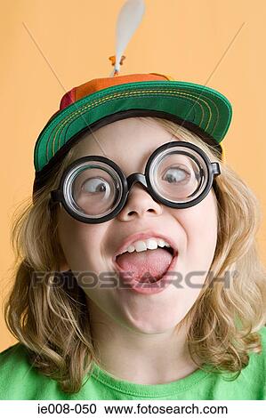 Girl wearing silly glasses and hat View Large Photo Image Stock Image - Girl wearing silly glasses and hat. Fotosearch