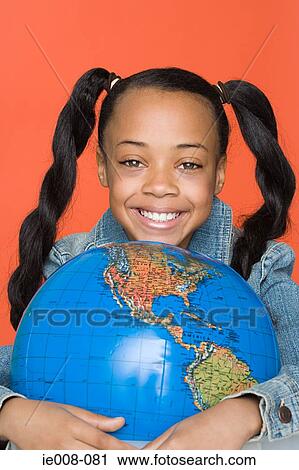 Girl with globe View Large Photo Image Stock Image - Girl with globe. Fotosearch
