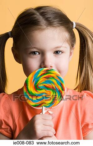 Girl with lollipop View Large Photo Image Stock Image - Girl with lollipop. Fotosearch