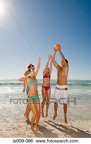 Friends playing volleyball View Large Photo Image Stock Photograph - Friends playing volleyball. Fotosearch