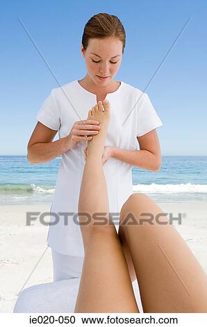 Woman having feet massaged View Large Photo Image Stock Image - Woman having feet massaged. Fotosearch