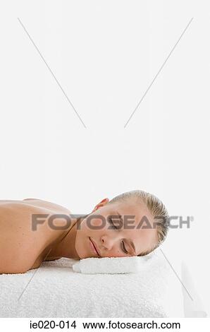 Picture - Young woman lying on front. Fotosearch