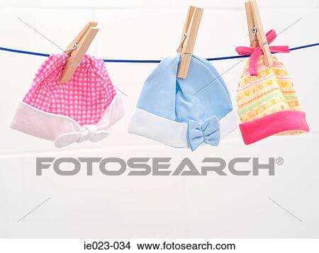 Baby bonnets on washing line View Large Photo Image Picture - Baby bonnets on washing line. Fotosearch