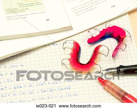Braces on homework View Large Photo Image Stock Image - Braces on homework. Fotosearch