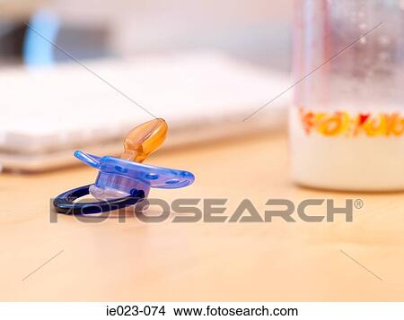 Dummy and baby bottle View Large Photo Image Picture - Dummy and baby bottle. Fotosearch