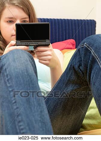 Girl playing computer game View Large Photo Image Stock Photography - Girl playing computer game. Fotosearch