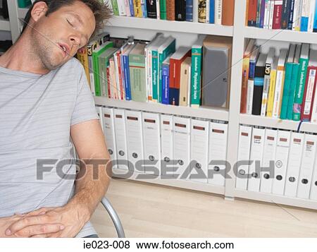 Man asleep by bookshelf View Large Photo Image Stock Photo - Man asleep by bookshelf. Fotosearch