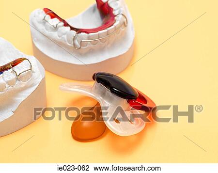 Stock Image - Pacifier and braces. Fotosearch