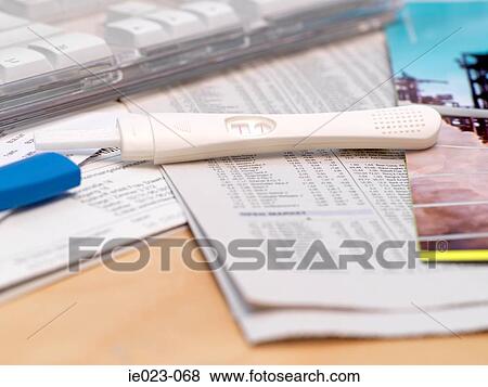 Pregnancy test on desk View Large Photo Image Stock Photo - Pregnancy test on desk. Fotosearch