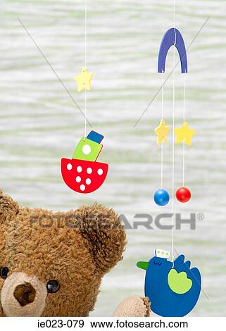 Teddy bear and mobile View Large Photo Image Stock Photo - Teddy bear and mobile. Fotosearch