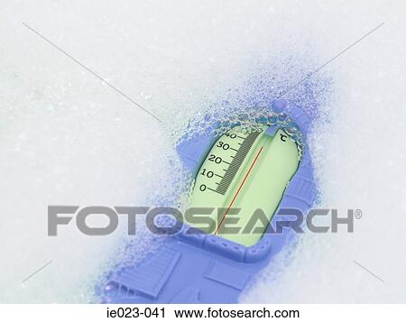 Stock Image - Thermometer in bath. Fotosearch
