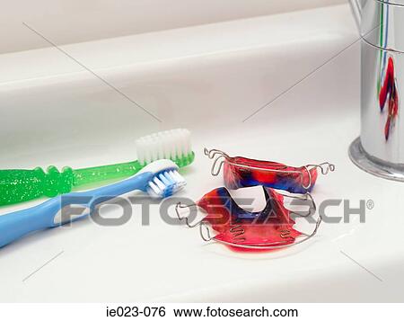 Toothbrushes and braces View Large Photo Image Stock Photograph - Toothbrushes and braces. Fotosearch