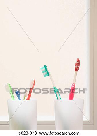 Toothbrushes in beakers View Large Photo Image Stock Photo - Toothbrushes in beakers. Fotosearch