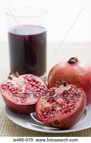 Pomegranates and pomegranate juice View Large Photo Image Stock Image - Pomegranates and pomegranate juice. Fotosearch