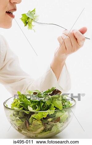 Woman eating lettuce View Large Photo Image Stock Image - Woman eating lettuce. Fotosearch