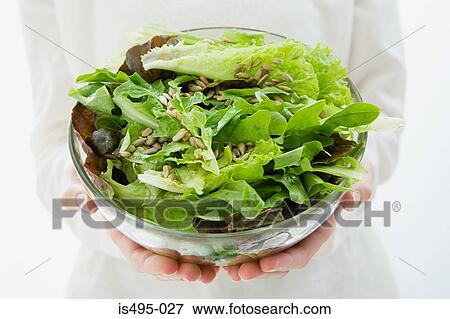 Woman holding a bowl of salad View Large Photo Image Stock Photo - Woman holding a bowl of salad. Fotosearch