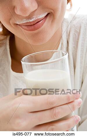 Woman with a milk moustache View Large Photo Image Stock Photo - Woman with a milk moustache. Fotosearch