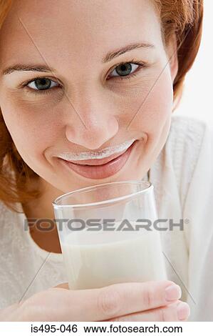 Woman with a milk moustache View Large Photo Image Stock Photograph - Woman with a milk moustache. Fotosearch