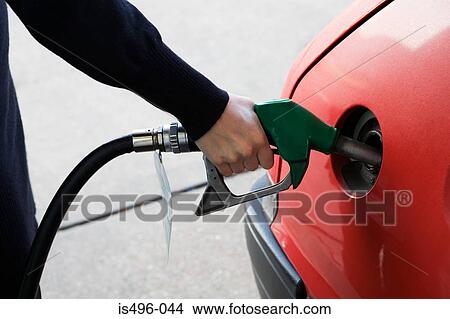Person filling petrol tank View Large Photo Image Picture - Person filling petrol tank. Fotosearch