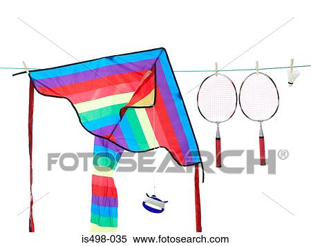 Stock Photography - A kite and badminton rackets on a washing line. Fotosearch