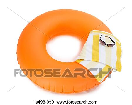 Inflatable ring beach towel and sunglasses View Large Photo Image Stock Photo - Inflatable ring beach towel and sunglasses . Fotosearch