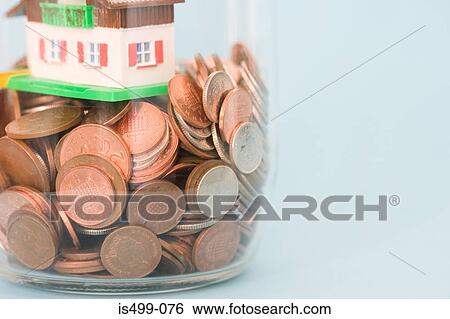 Saving for a house View Large Photo Image Stock Photograph - Saving for a house. Fotosearch