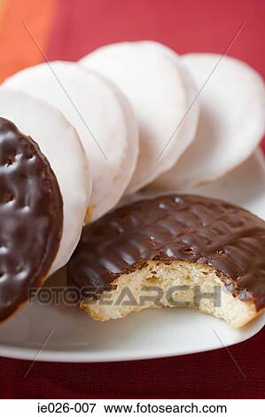 A biscuit with a missing bite View Large Photo Image Stock Photo - A biscuit with a missing bite. Fotosearch