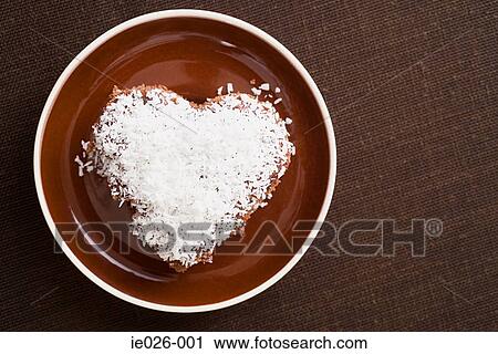 A cake decorated in desiccated coconut View Large Photo Image Stock Image - A cake decorated in desiccated coconut. Fotosearch