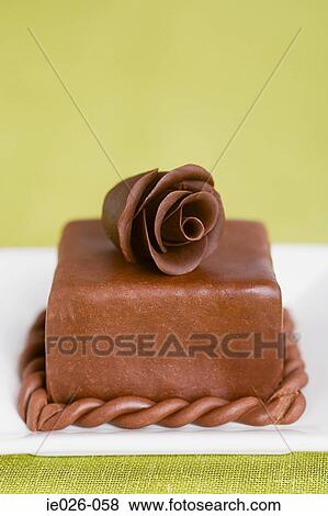 A cake decorated with a chocolate rose View Large Photo Image Stock Photo - A cake decorated with a chocolate rose. Fotosearch