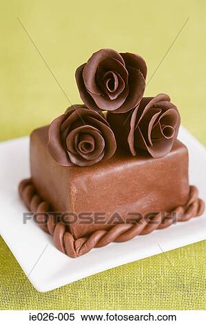 A cake decorated with chocolate roses View Large Photo Image Stock Photography - A cake decorated with chocolate roses. Fotosearch