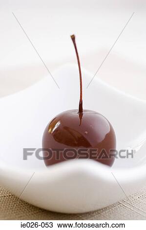 A cherry covered in chocolate View Large Photo Image Stock Image - A cherry covered in chocolate. Fotosearch