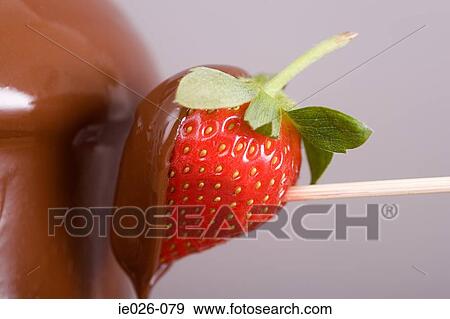 A strawberry covered in chocolate View Large Photo Image Stock Photo - A strawberry covered in chocolate. Fotosearch