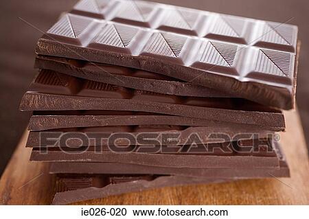 Chocolate bars in a pile View Large Photo Image Stock Image - Chocolate bars in a pile. Fotosearch
