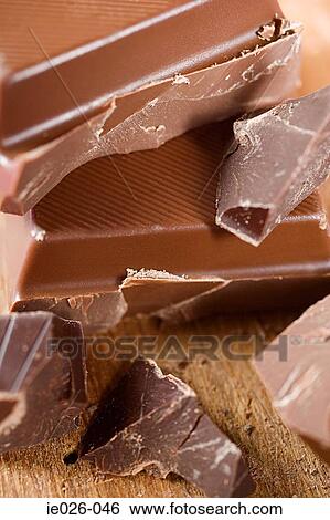 Pile of chocolate pieces View Large Photo Image Stock Photograph - Pile of chocolate pieces. Fotosearch